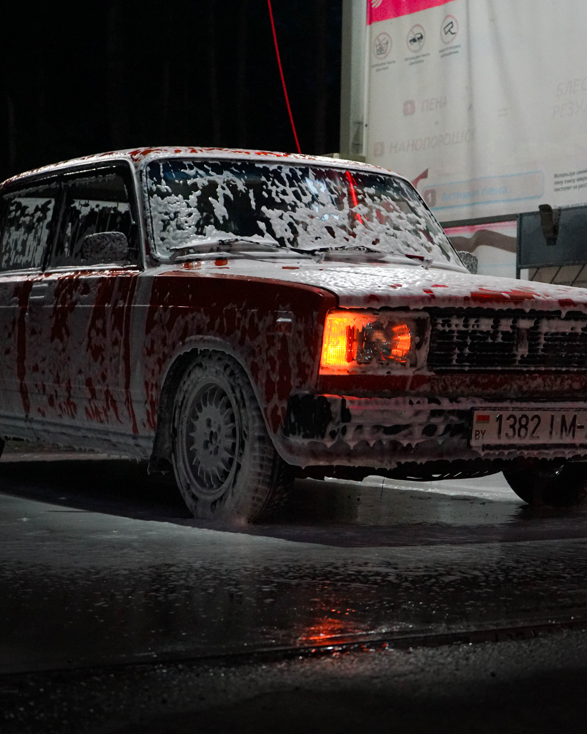 Red Car Soaked With Soap